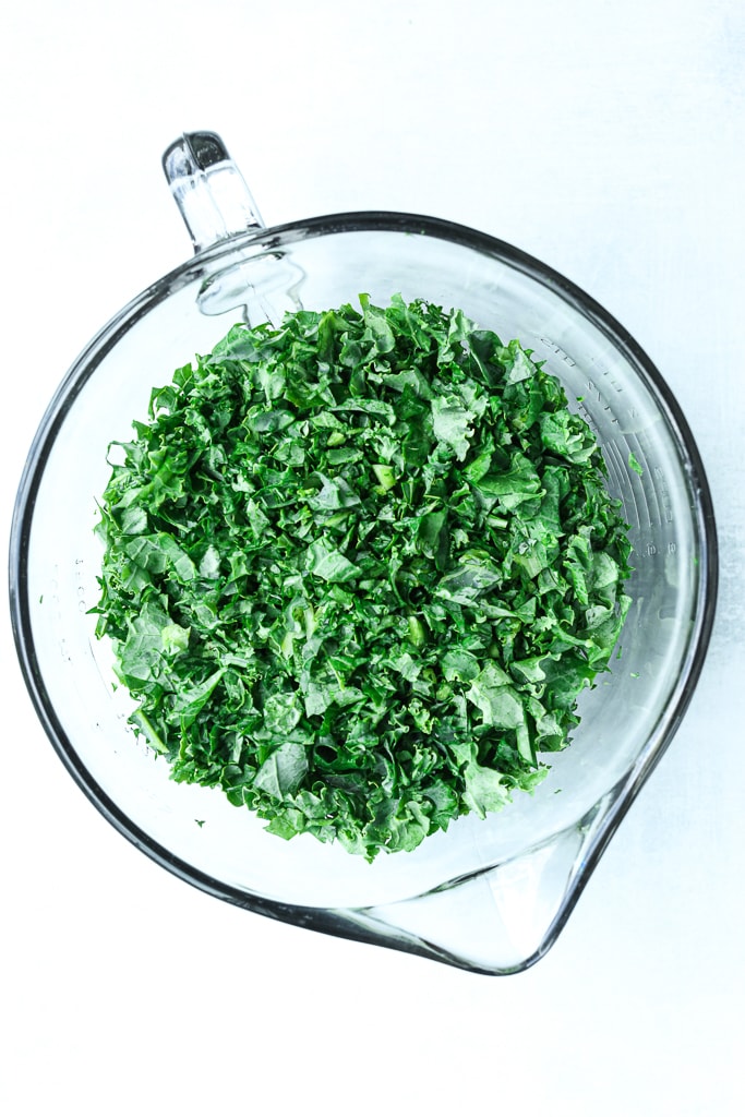 kale finely chopped in a glass measuring cup