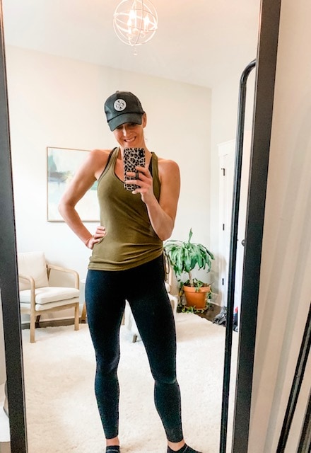 a woman taking a selfie in a mirror