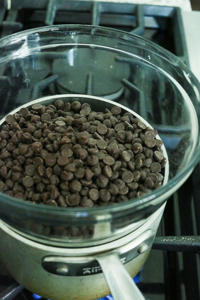 chocolate chips in a glass bowl on the stove