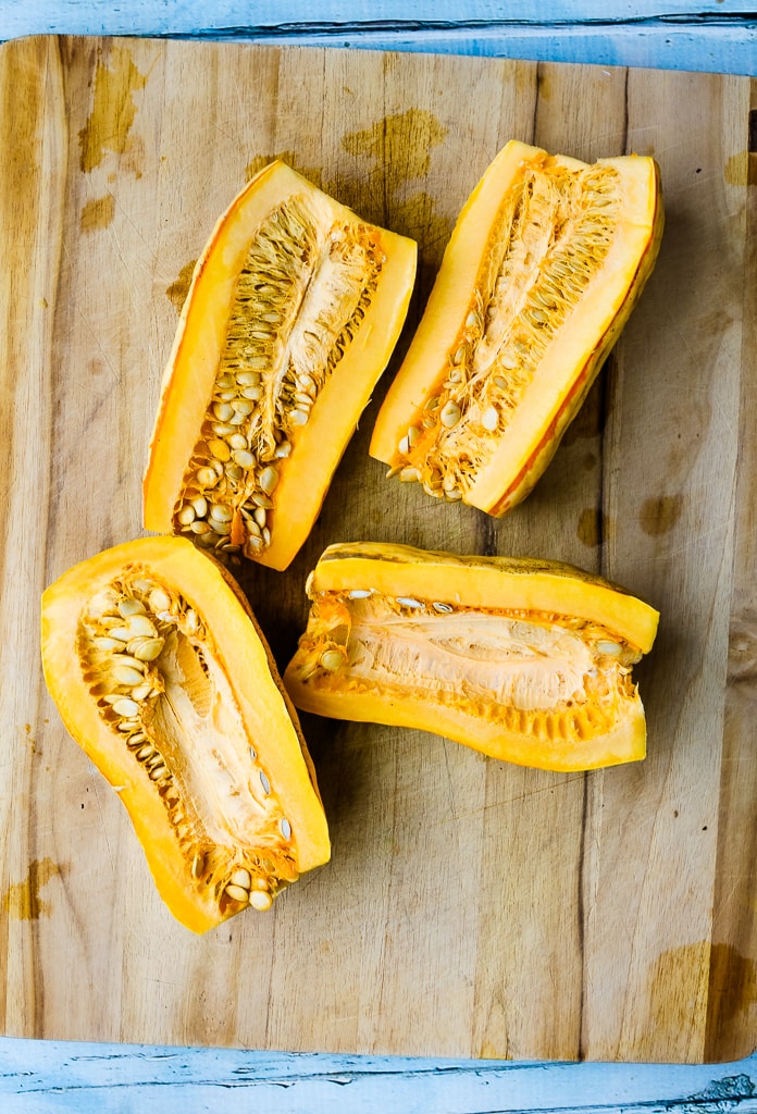 two delicata squashes cut in half