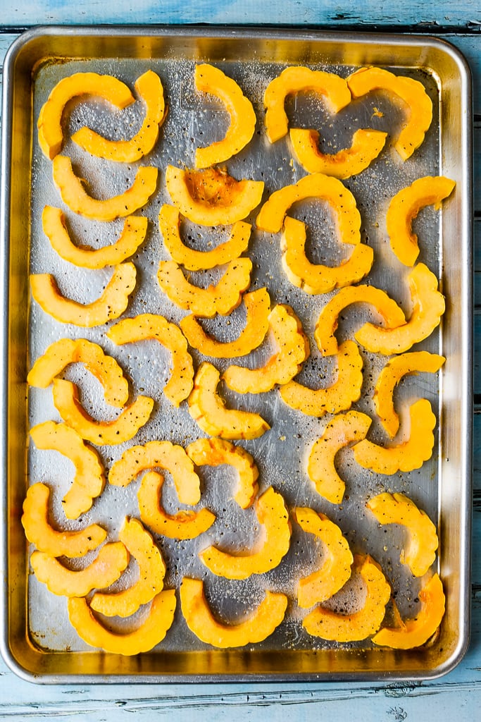 a baking sheet with sliced squash