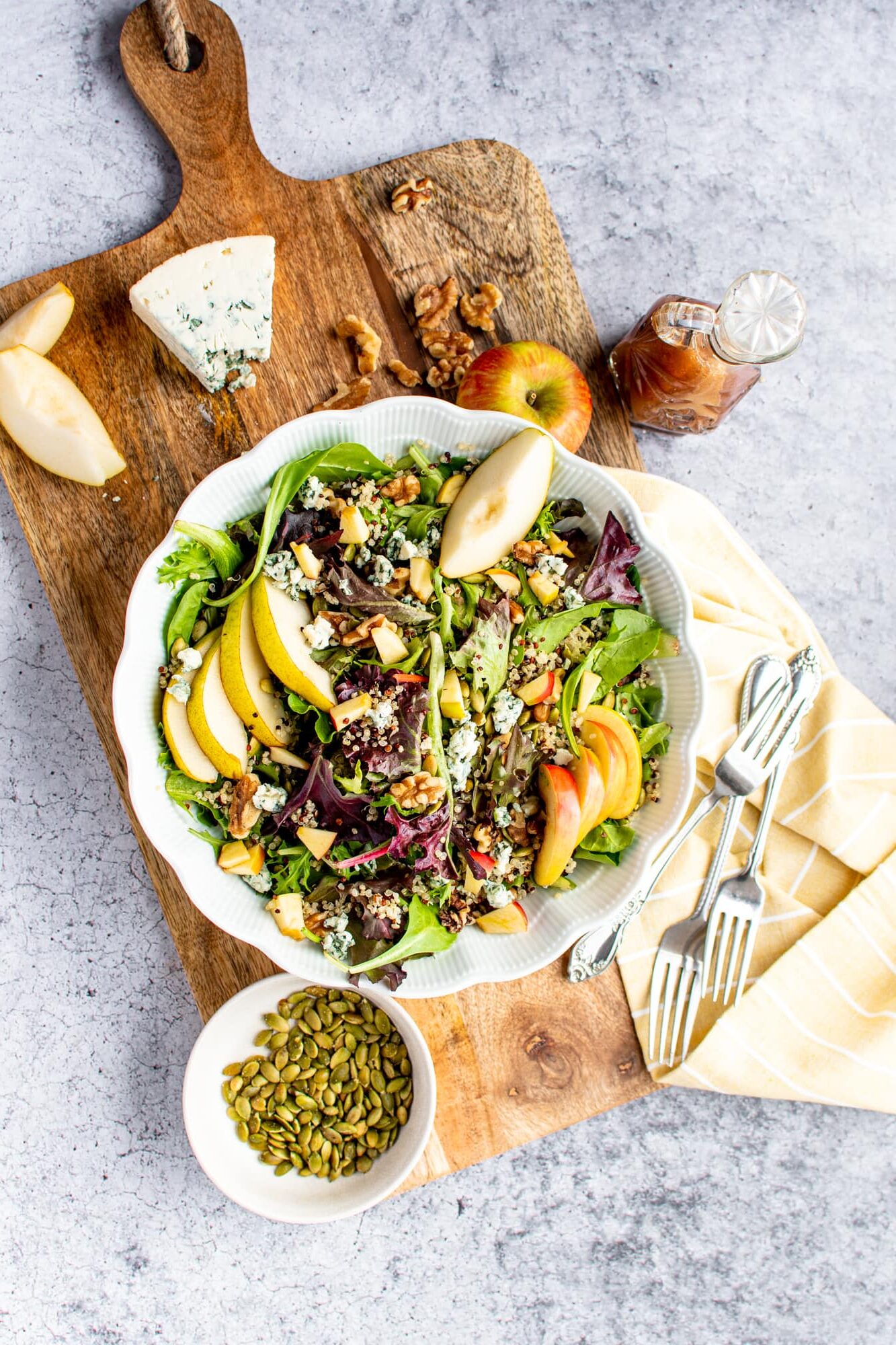 overhead shot of a gorgeous plated salad with pear slices