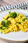 close up shot of broccoli cheddar orzo bake on plate