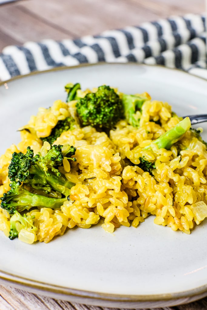 close up shot of broccoli cheddar orzo bake on plate