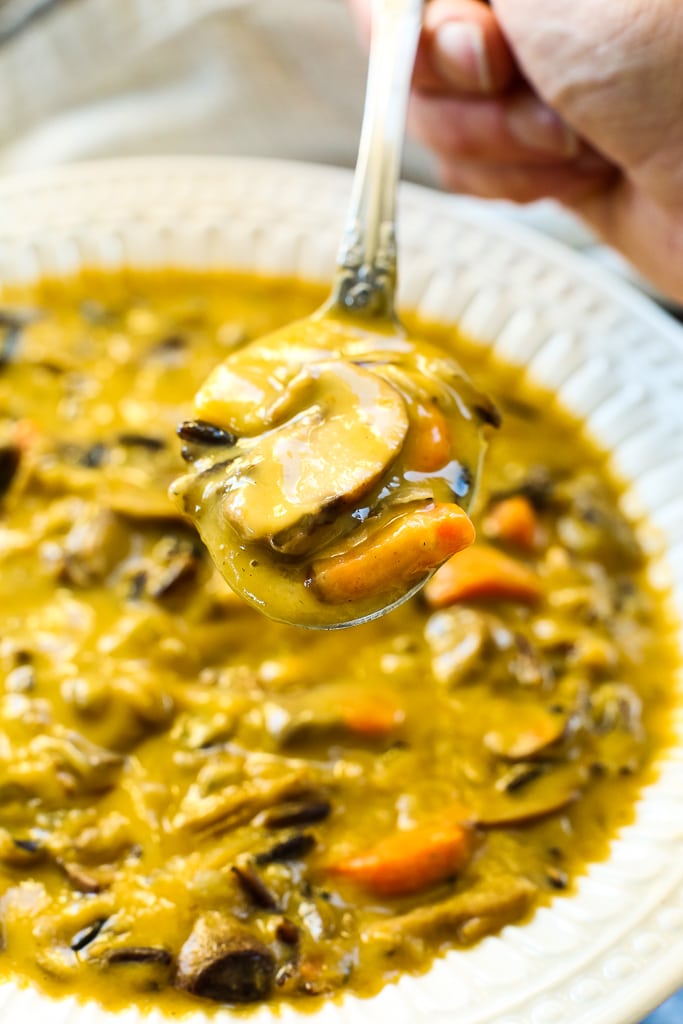 a spoonful of Vegan Mushroom Wild Rice Soup