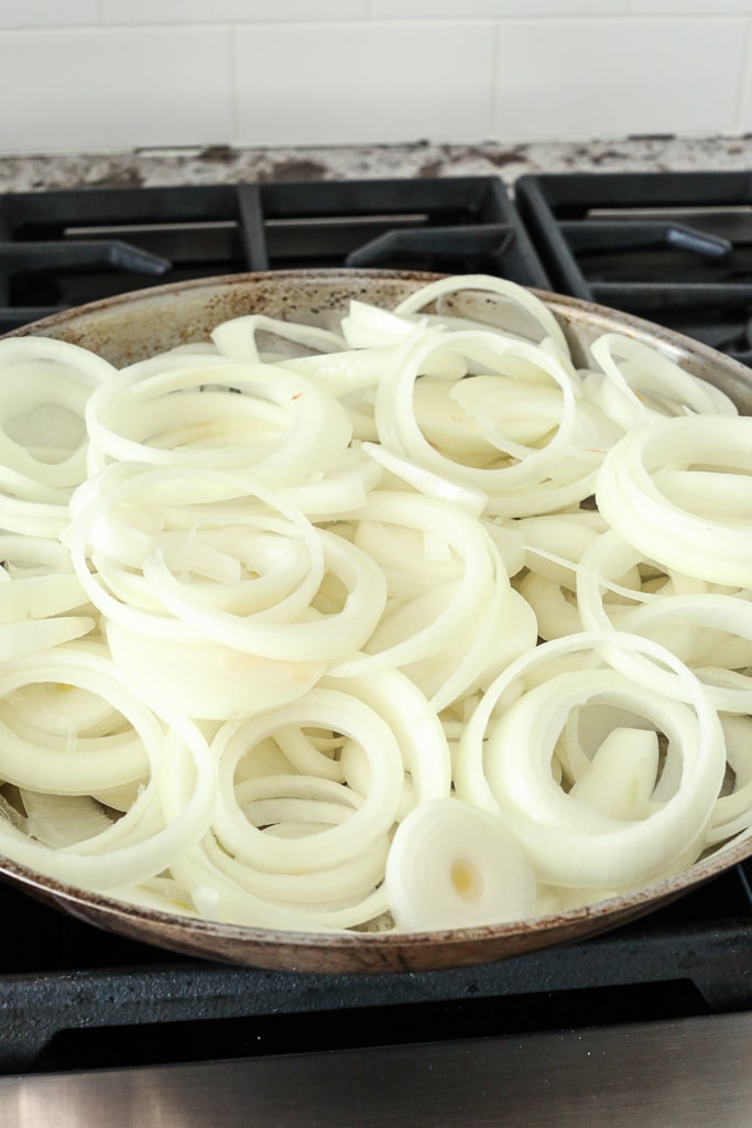 raw onions in a pan getting ready to cook