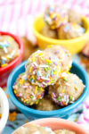 a colorful blue bowl of birthday cake energy balls