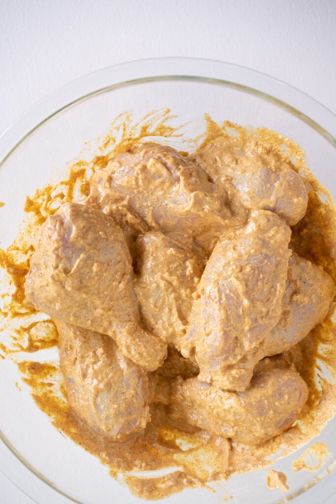 raw chicken in tandoori marinade
