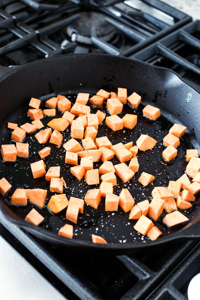 sweet potato cubes in a black cast iron skillet