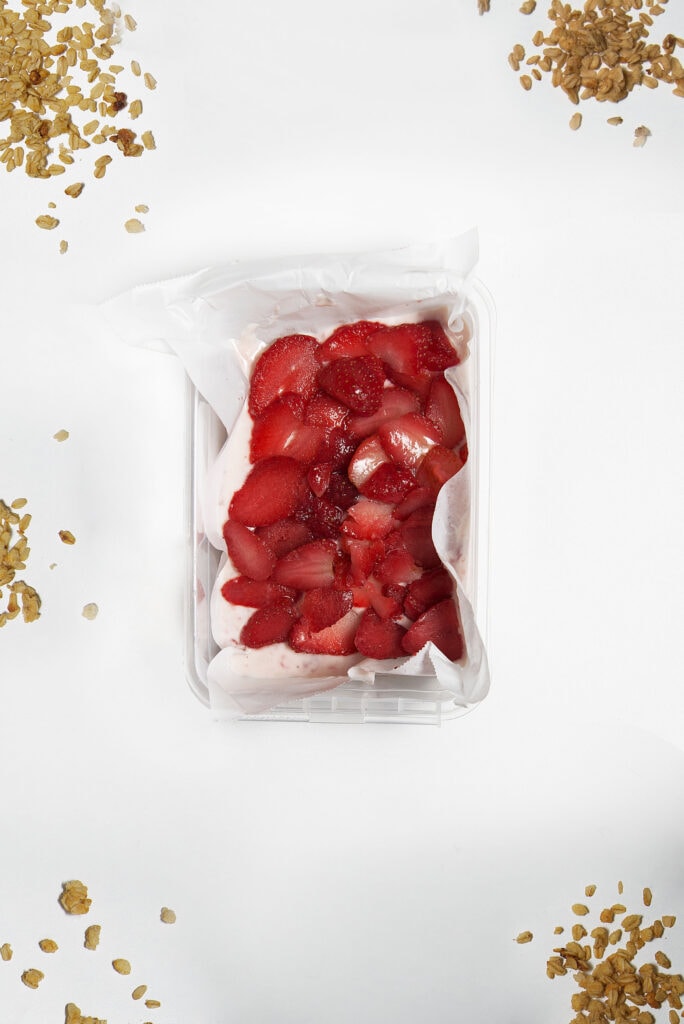 strawberries on top of yogurt