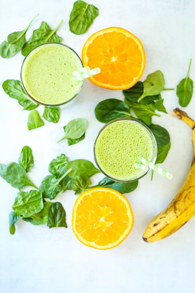 overhead shot of two spinach smoothies
