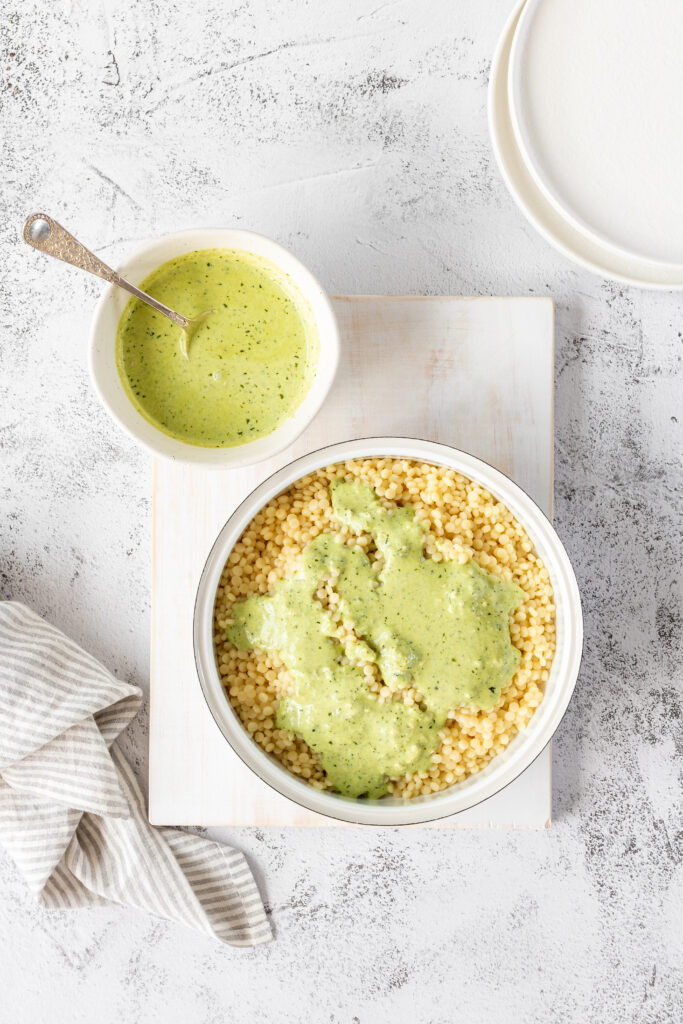 adding dressing to coscous