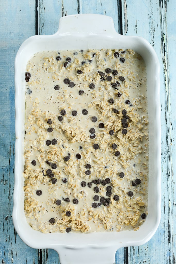 uncooked baked oatmeal in a white baking dish