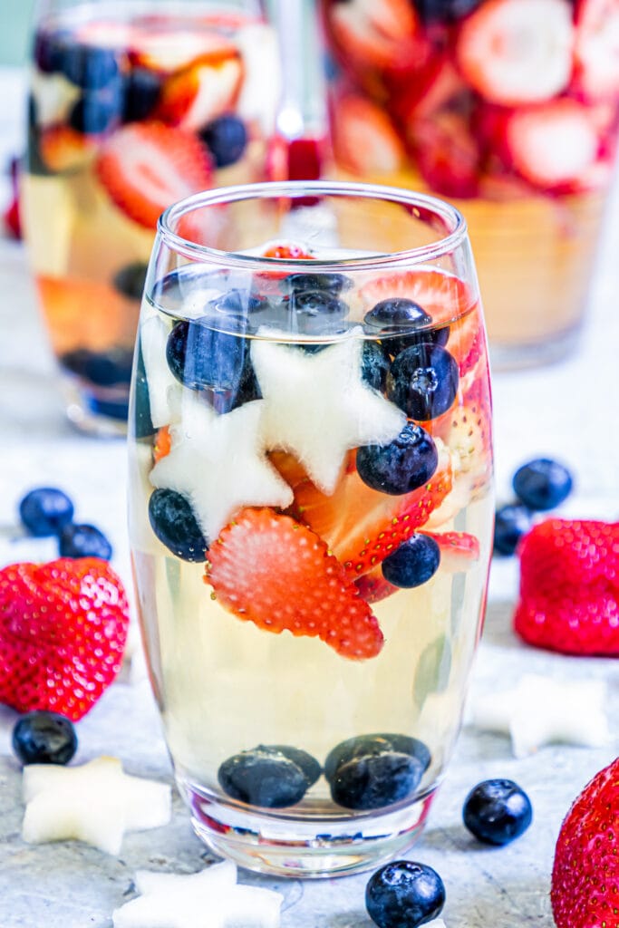 Patritotic Sangria recipe close up in a glass with fruit