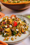 Lentil salad recipe on a plate with a fork
