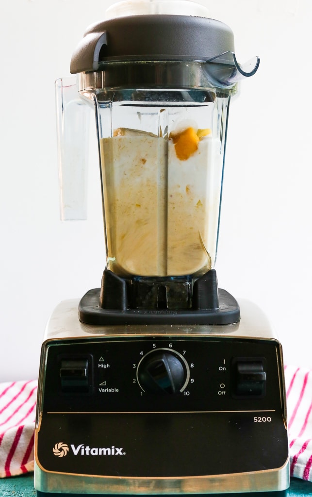 ingredients for mango smoothie in a vita-mix blender