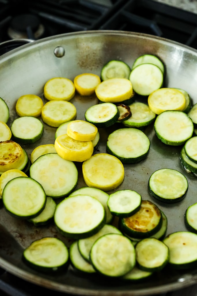 sauteing the zucchini and summer squash in a large skillet