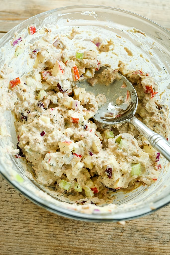 apple cranberry tuna salad recipe mixed in a glass bowl