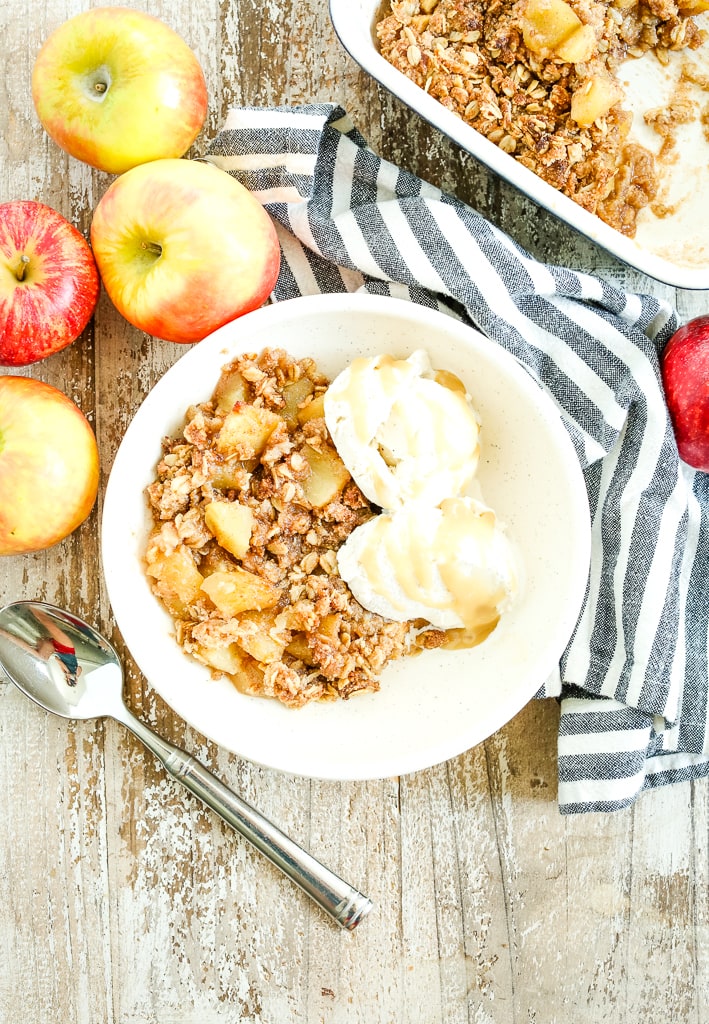 healthy apple crisp recipe vegan and gluten-free with apples and a striped napkin