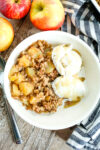 overhead shot of healthy apple crisp recipe with vanilla ice cream