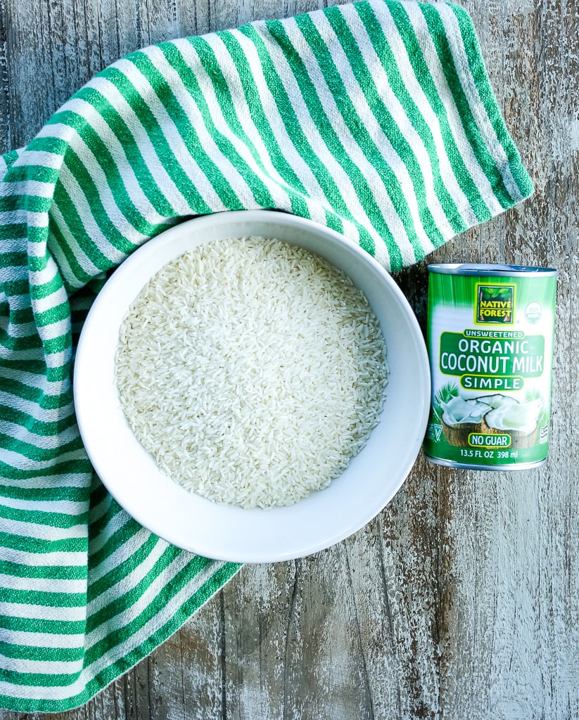 jasmine rice and a can of coconut milk with a green and white striped towel