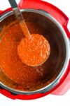 a ladle of Instant Pot Spaghetti Sauce recipe