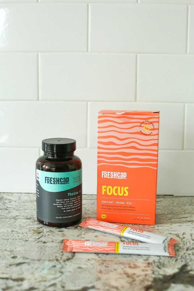A bottle of Freshcap Thrive 6 and an orange box of Focus