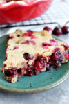close up shot of crustless cranberry pie on a green plate