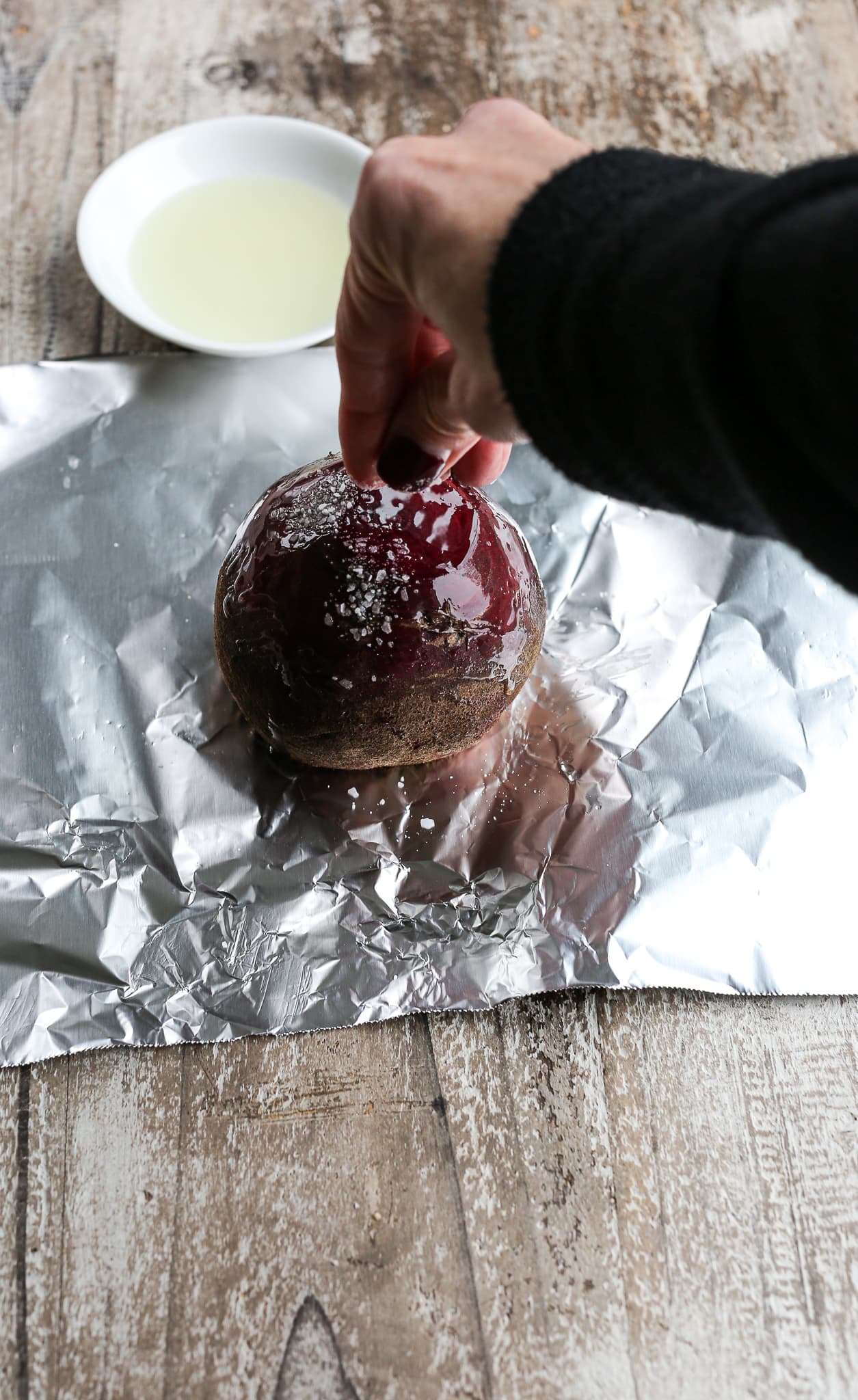 sprinkling salt on raw beet