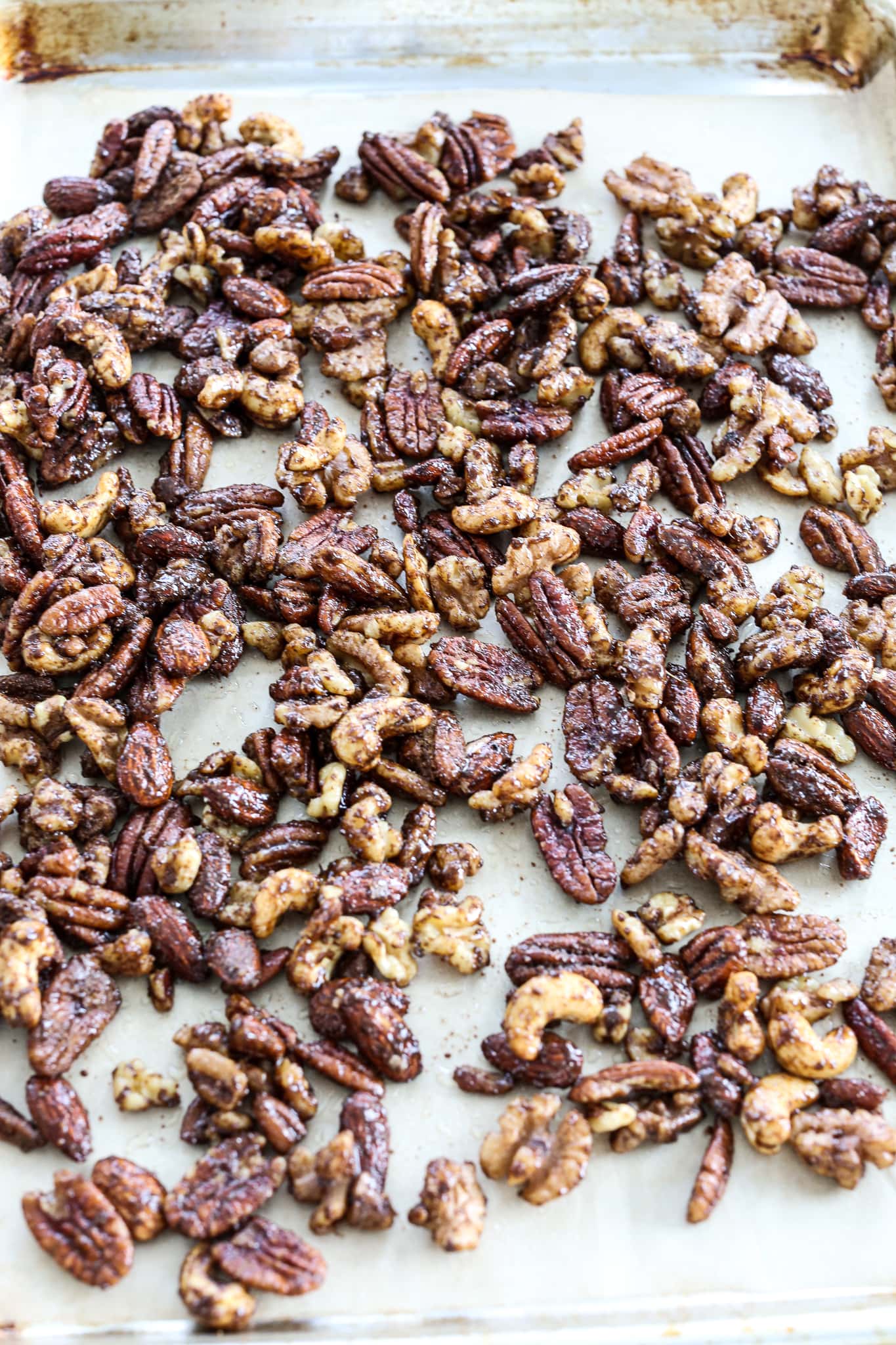 nuts on a pan with parchment paper