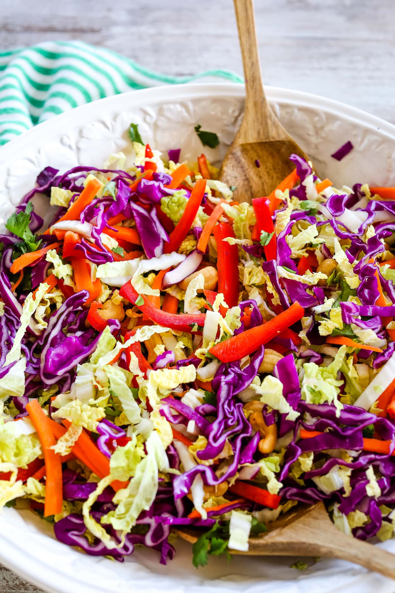 tossing colorful vegetables in a bowl