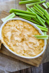 Dairy Free Buffalo Chicken Dip recipe in a small white dish with celery sticks