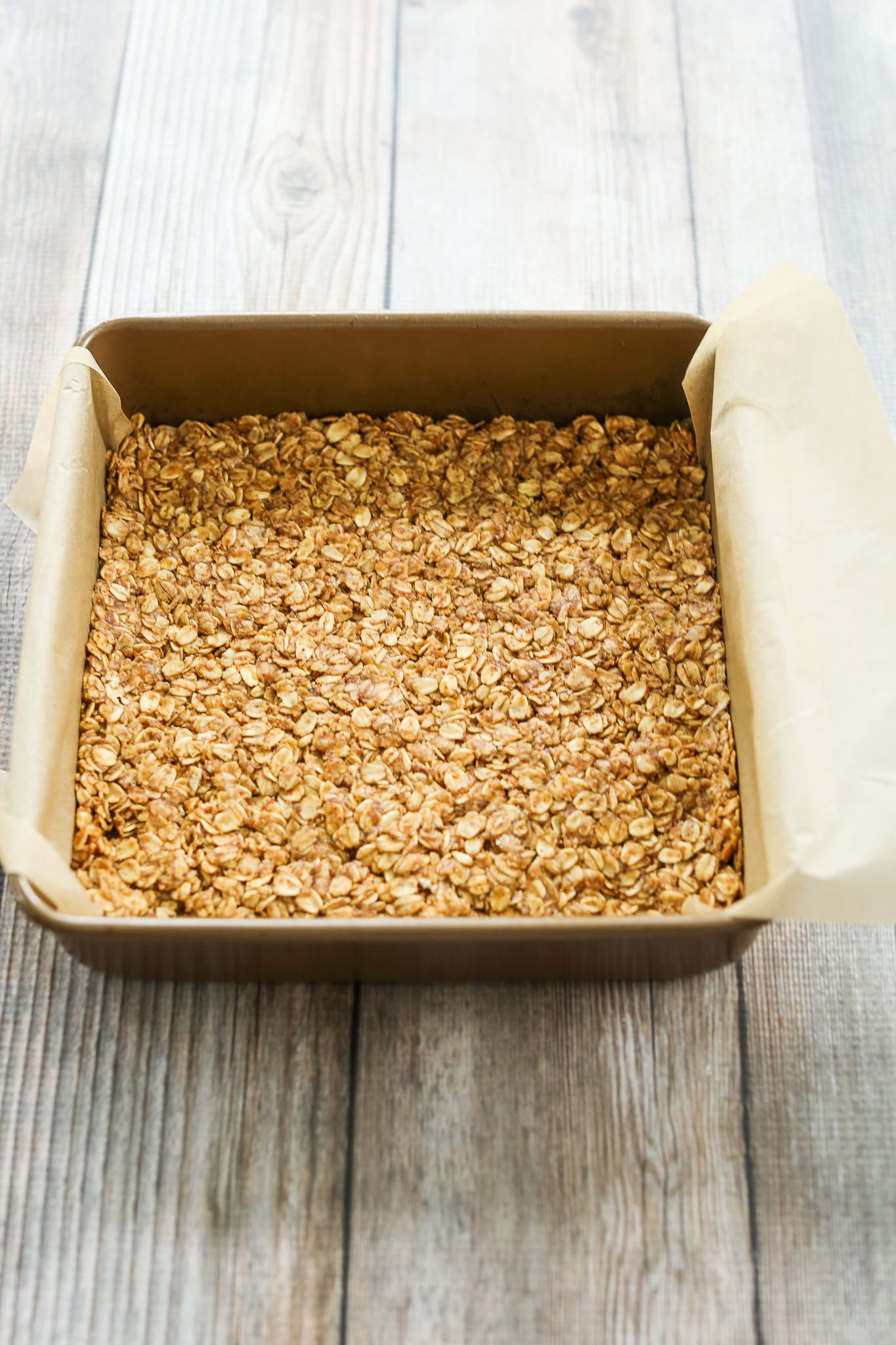 making No Bake Chocolate Oat Bars Recipe layer 1 in the pan