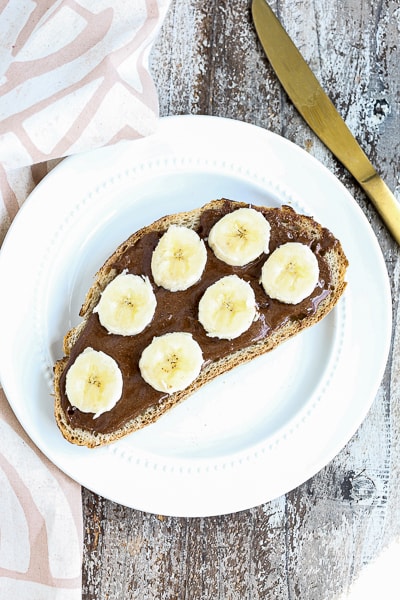 chocolate almond butter on toast with sliced banana