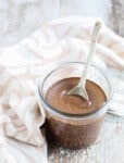 Chocolate Almond Butter recipe with a spoon in the glass jar