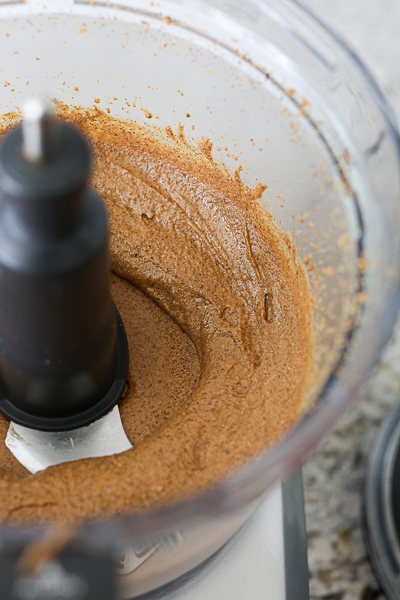 almonds being processed into almond butter in a food proccesor