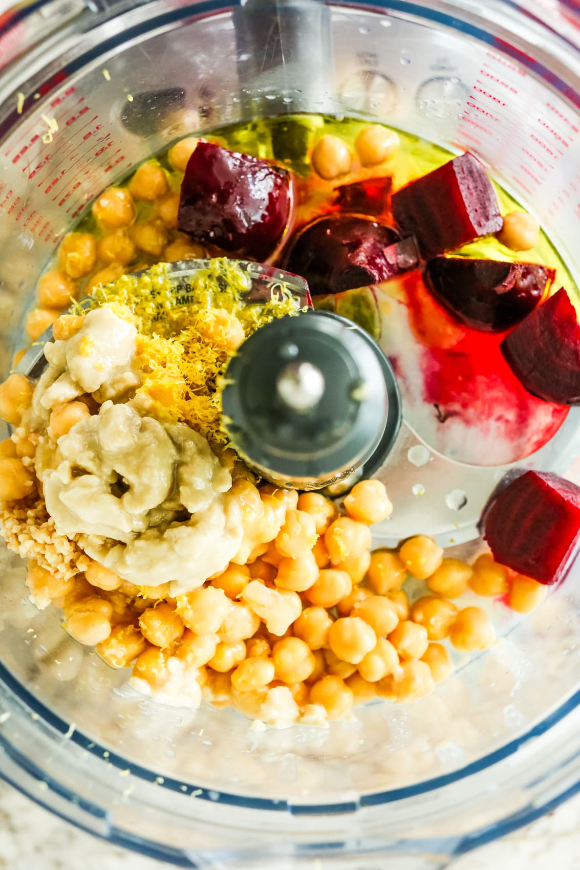 beets, chickpeas, tahini, lemon zest, and garlic in a bowl of a food processor