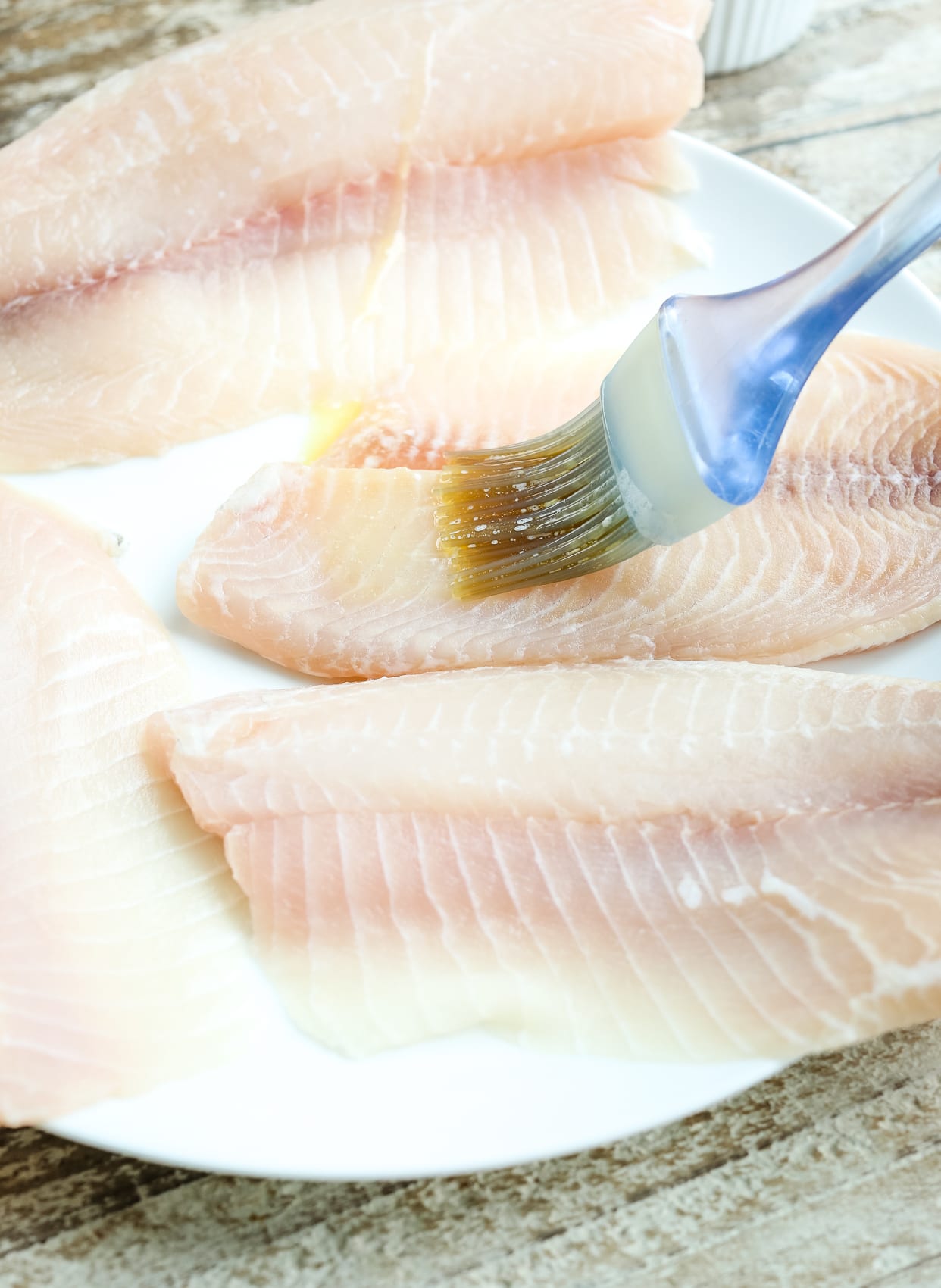 brushing tilapia with butter