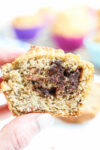 almond flour banana muffins with chocolate chips in the middle--a close up shot being held in a hand