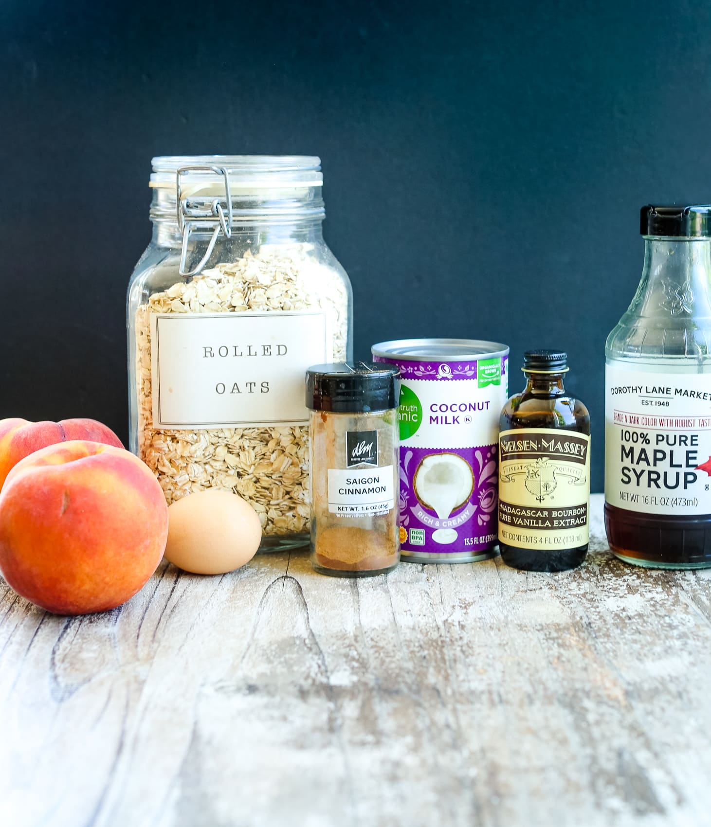 recipe ingredients on a board for peach baked oatmeal
