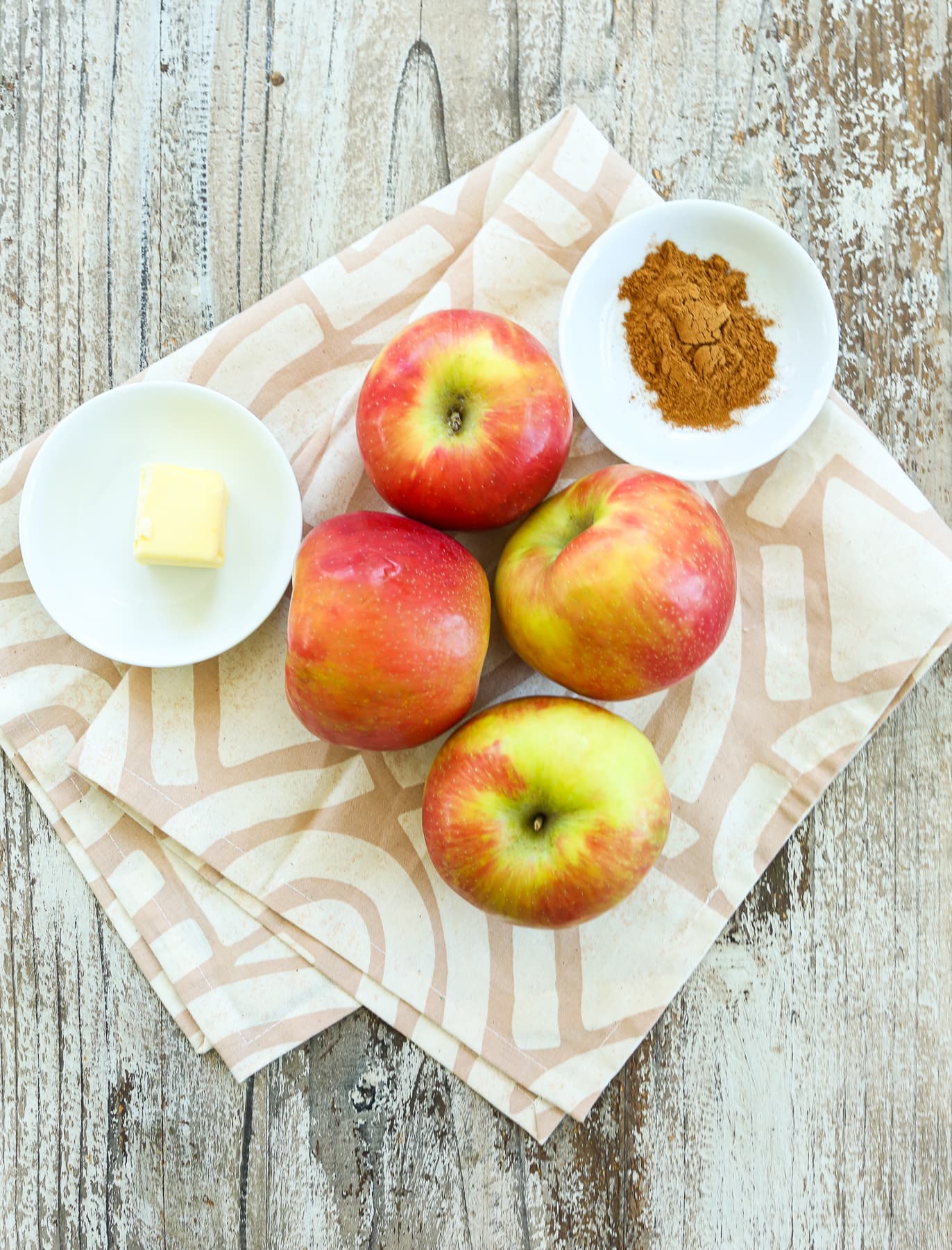 apples, cinnamon, and butter on a napkin