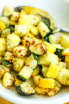 close up photo of zucchini and squash in a bowl