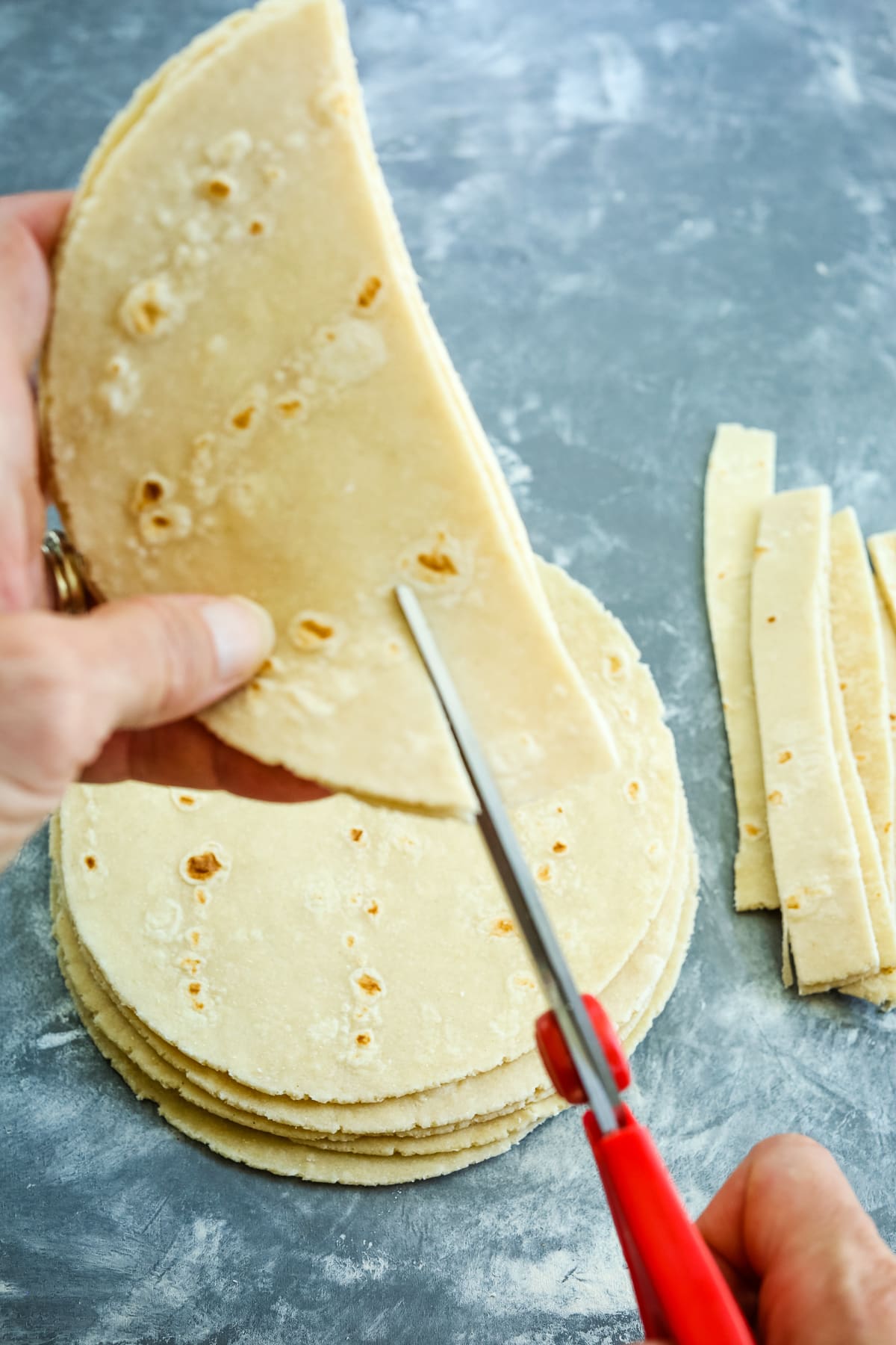 cutting tortillas into strips