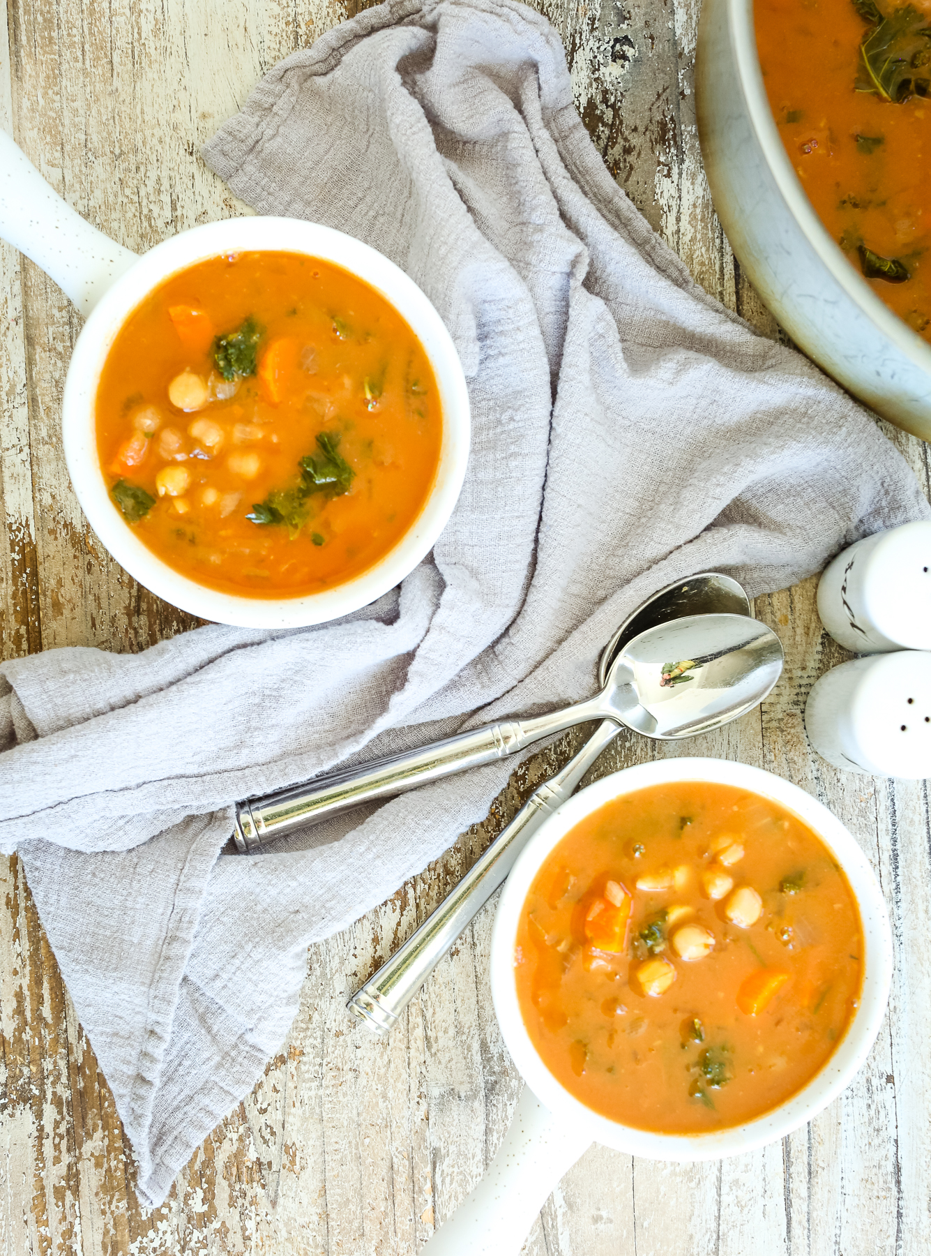 overhead shot of two bowls of chickpea soup 
