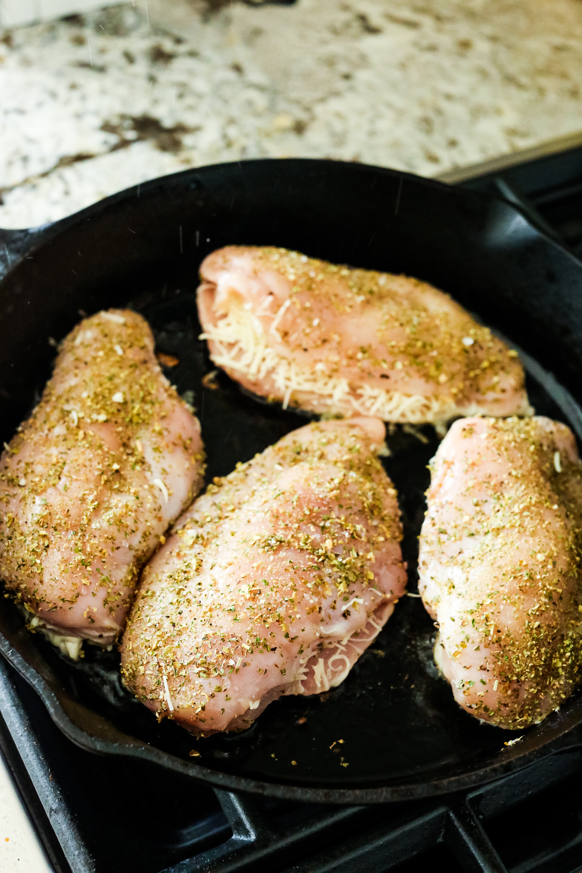 4 chicken breasts in a pan