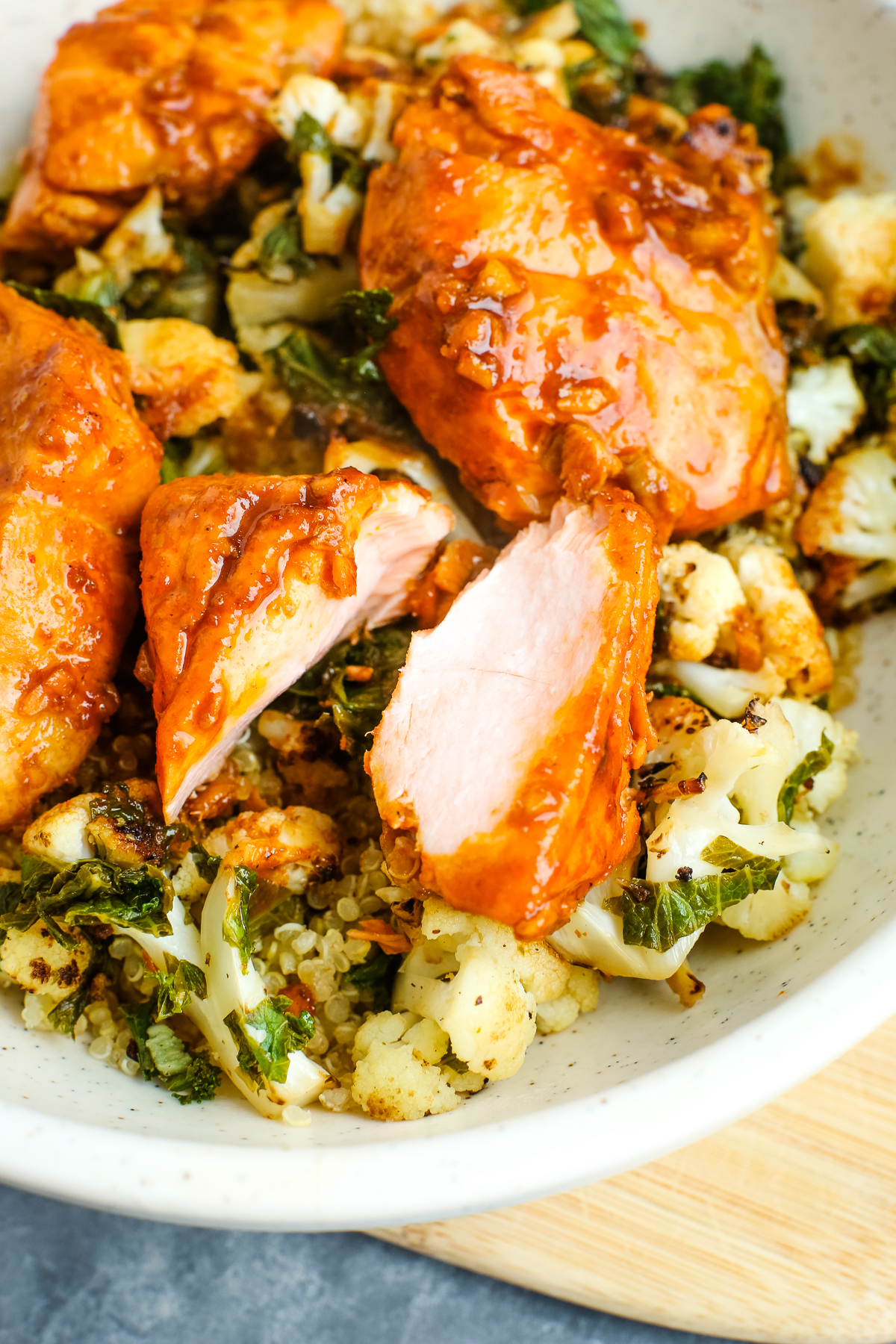 a piece of salmon broken to show the inside doneness