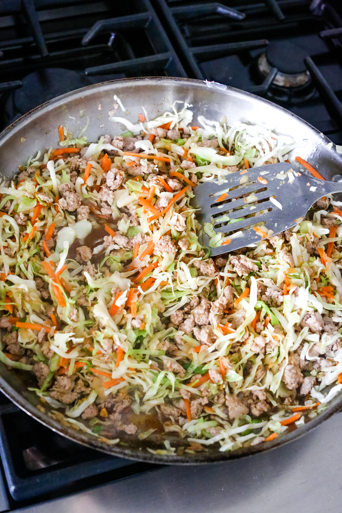 cooking Egg Roll in a Bowl recipe in a large skillet
