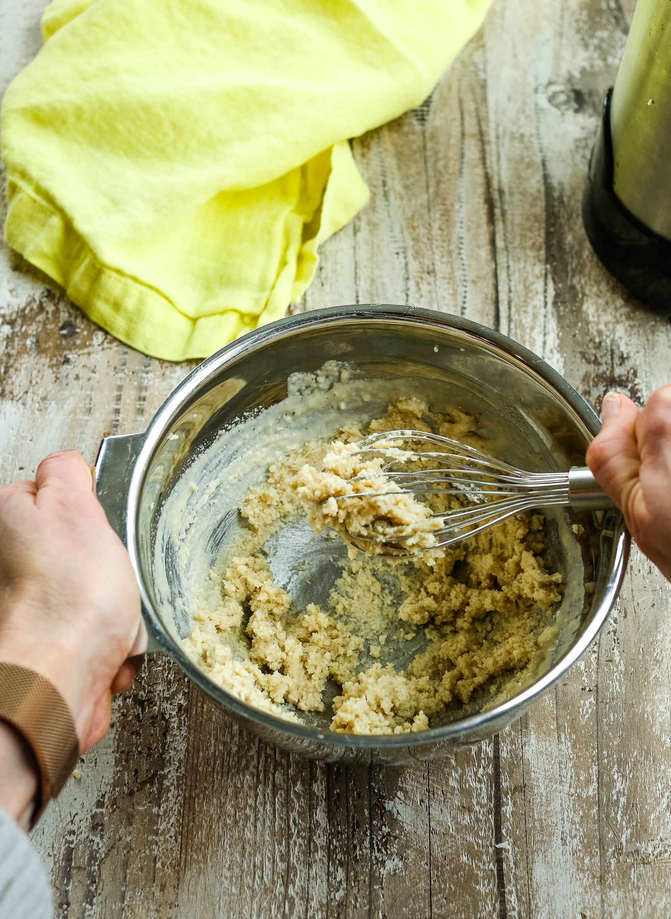 a thick mixture in a bowl being whisked