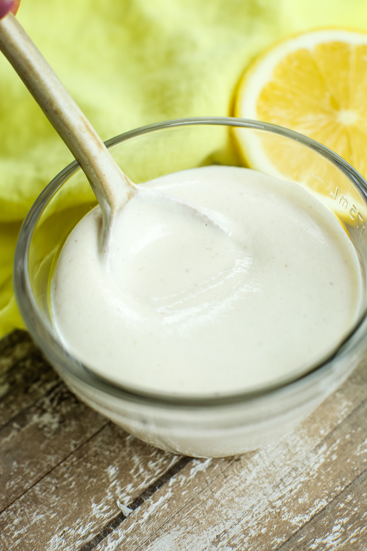 Garlic Tahini Sauce in a bowl with a spoon