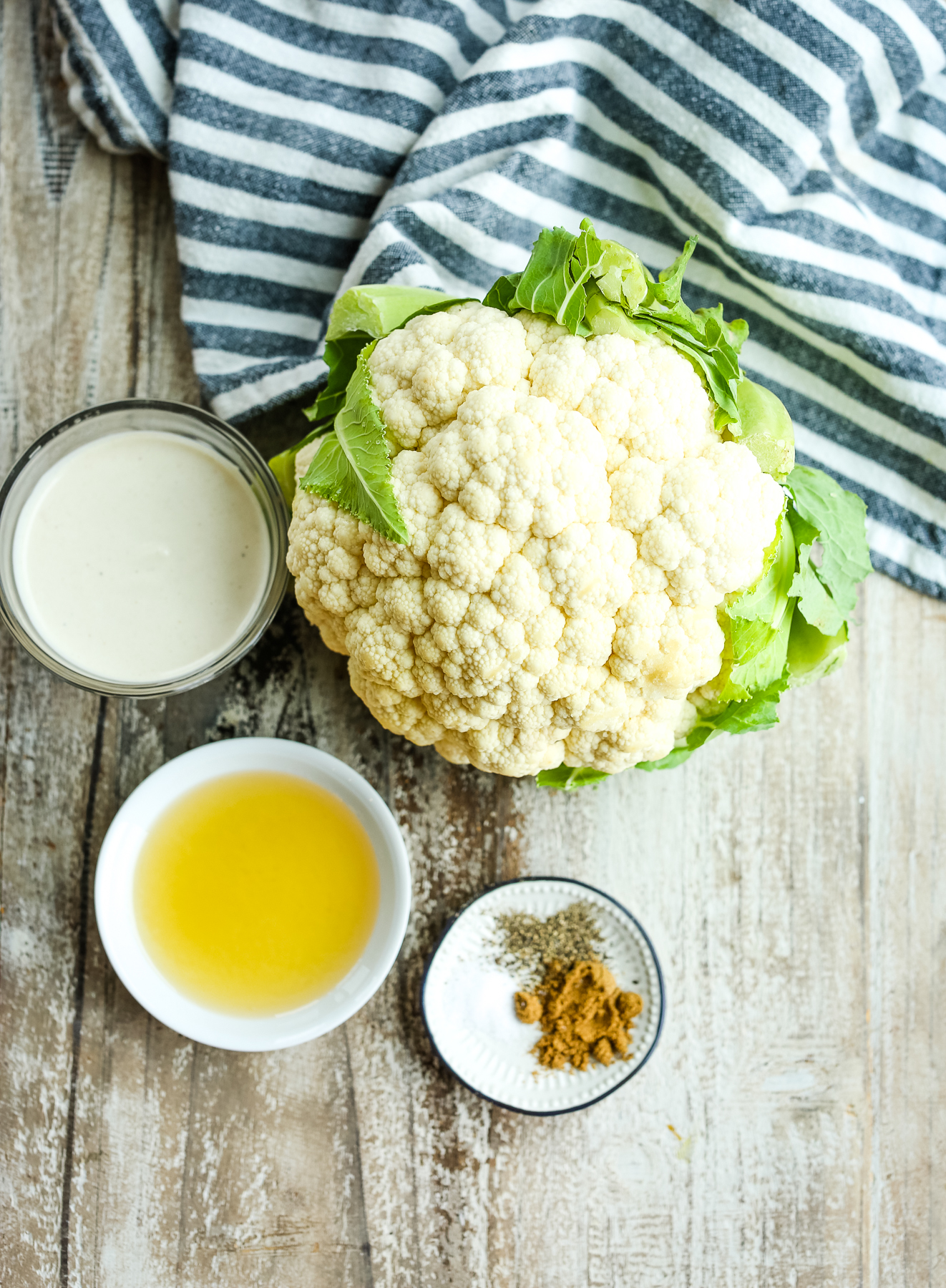 cauliflower, spices, oil, and tahini sauce
